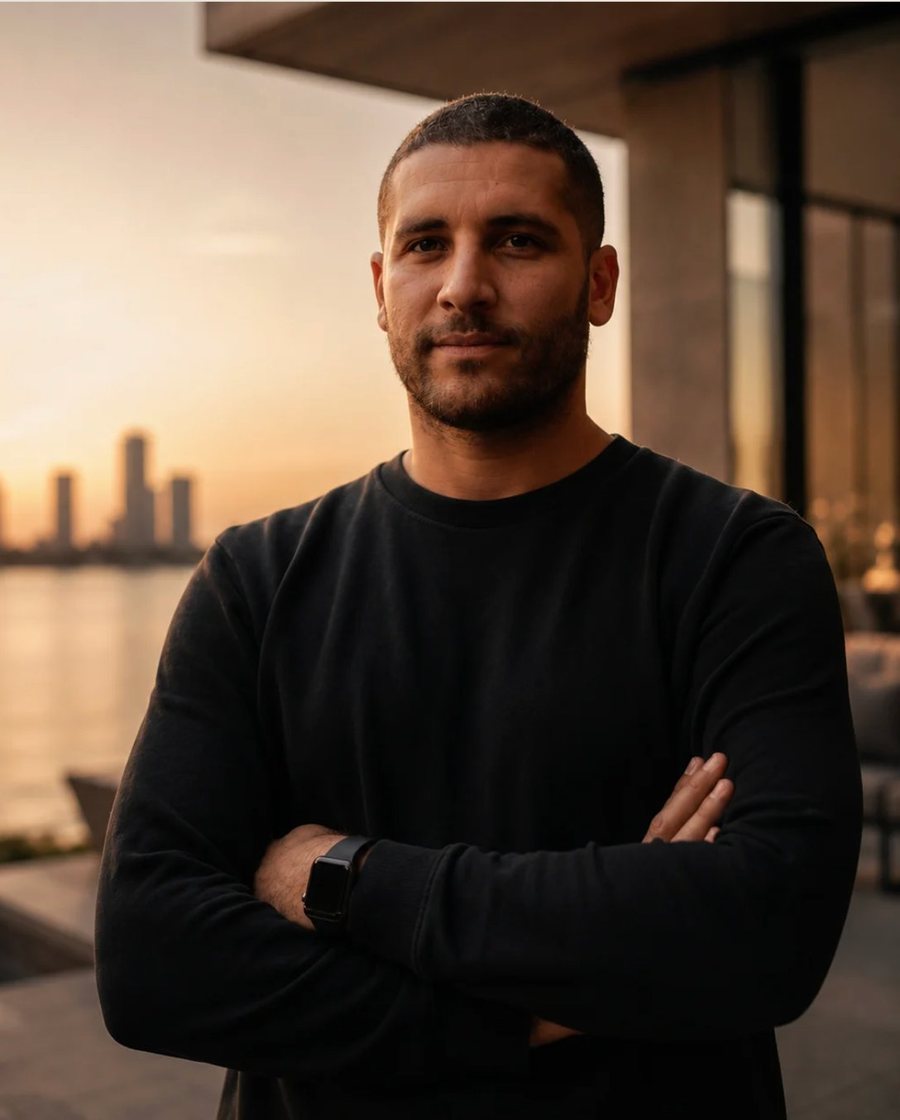 Alexandre Zibi on a waterfront terrace at sunset